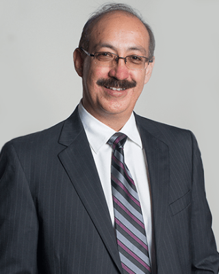 A. Enrique Caballero headshot.