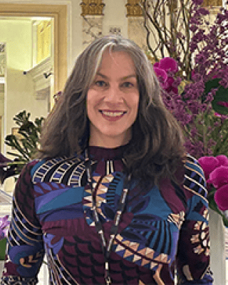 headshot of Dr Henin.