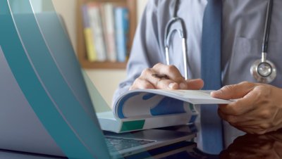 Health Professional Looking Through a Book