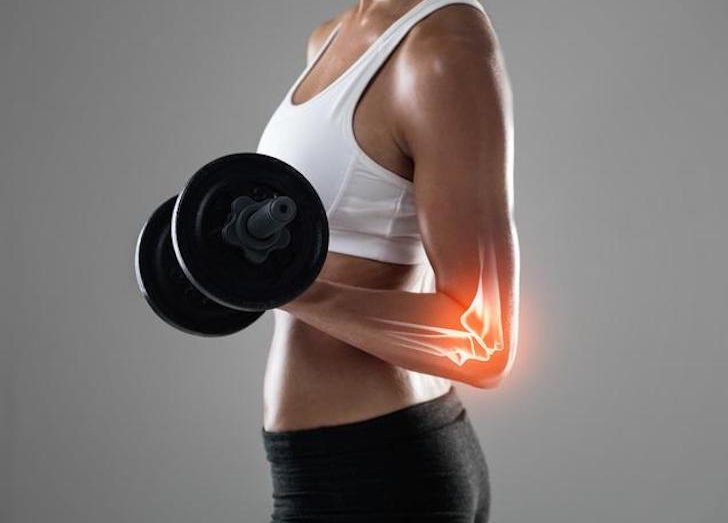 Woman lifting weight.