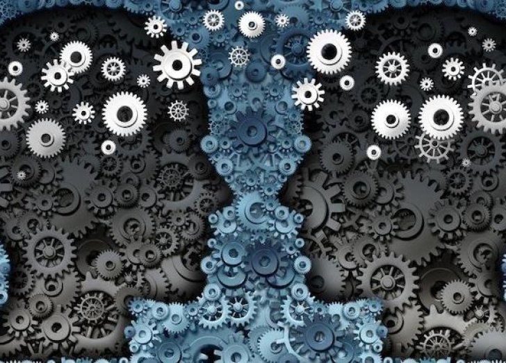 two silhouettes with gears over them facing each other.