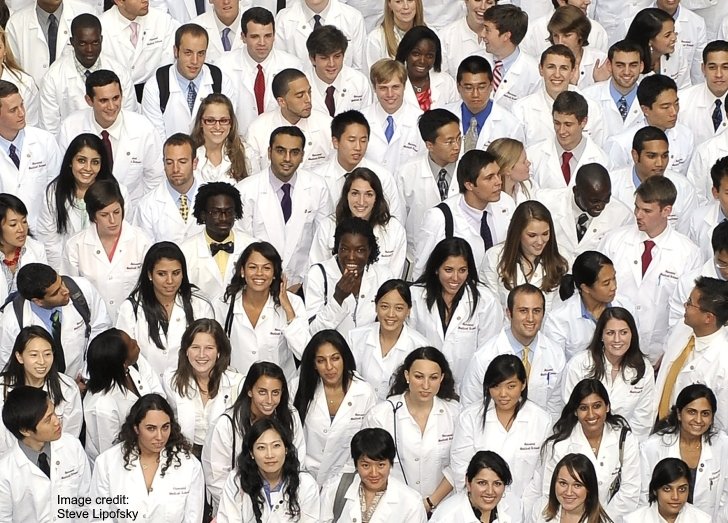 Crowd of new medical students looking up at camera