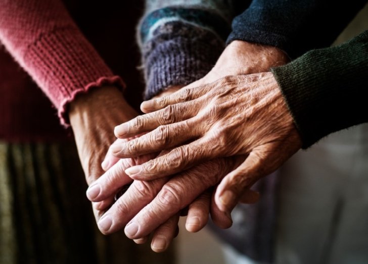 image of hands huddling together.