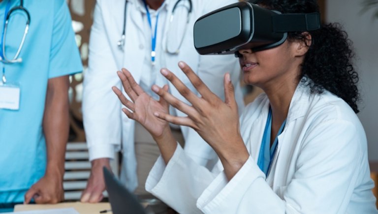 Female Doctor Uses AI Goggles among colleagues. 