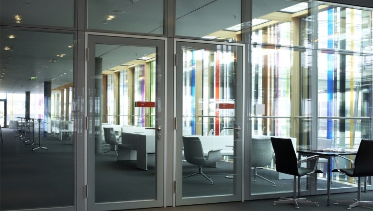 A lobby with colorful windows.