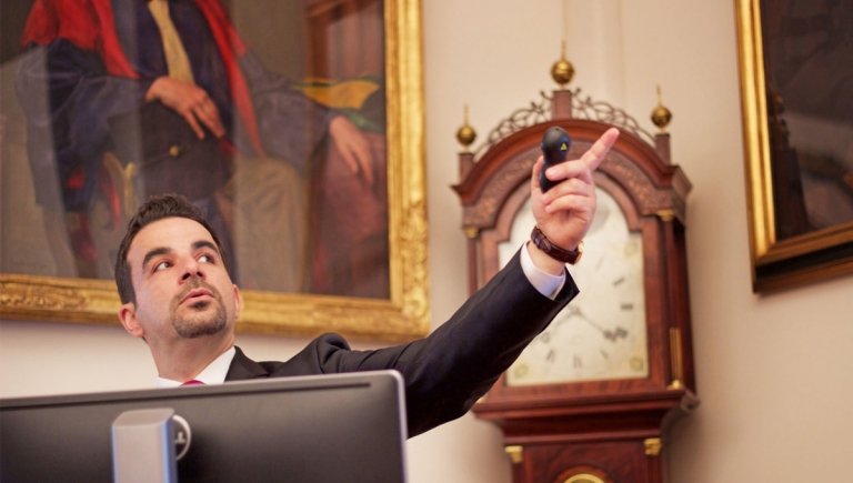 A man speaking and pointing.