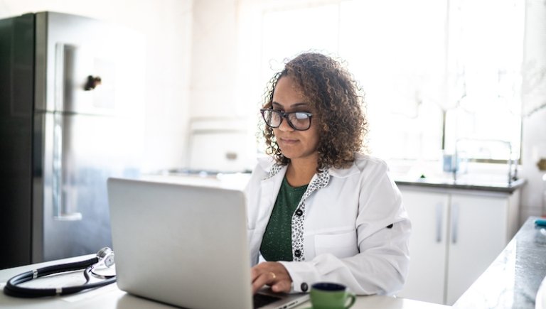 women typing on her laptop.