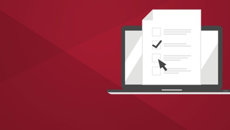 An illustration of a laptop with a piece of paper on the screen and a check mark on a crimson background.