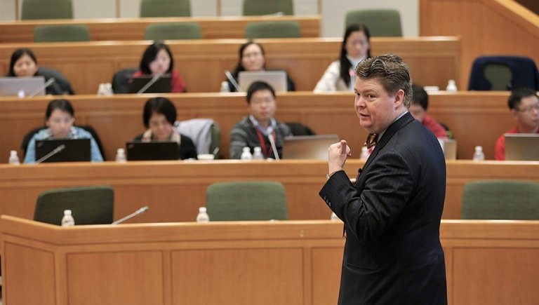 Faculty lecturing a class. 