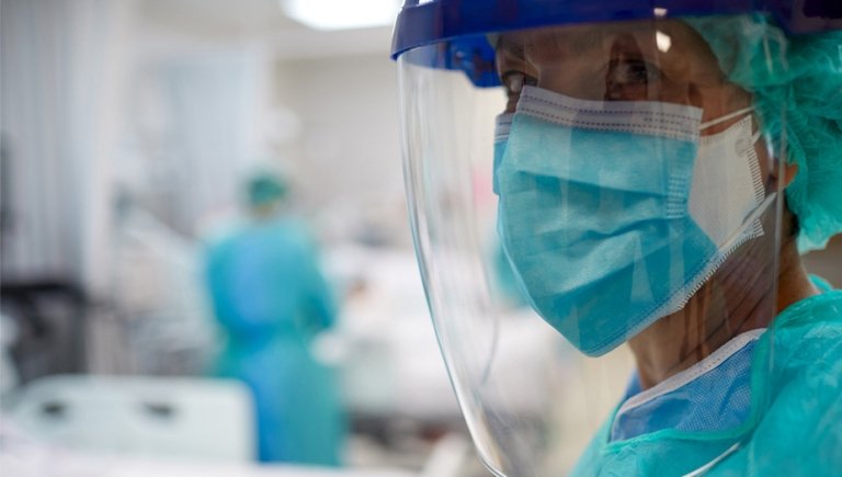 Physician with a mask on in a hospital. 