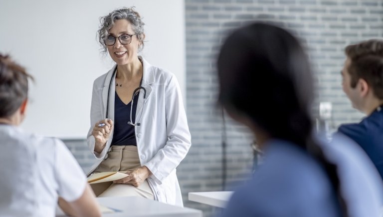 A health care provider speaking to a room.
