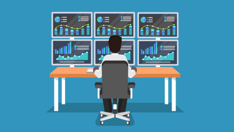 Person at desk looking at graphs of data.