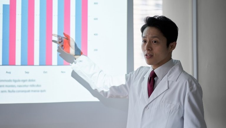 man showing his powerpoint and presenting.