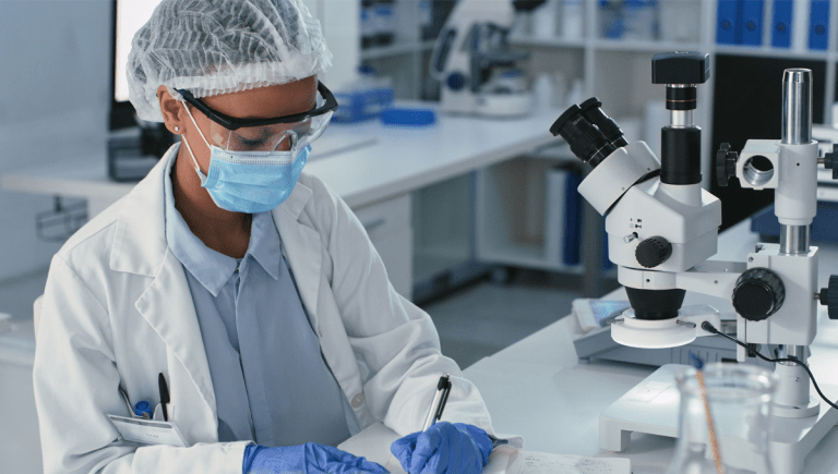 female scientist taking medical notes.