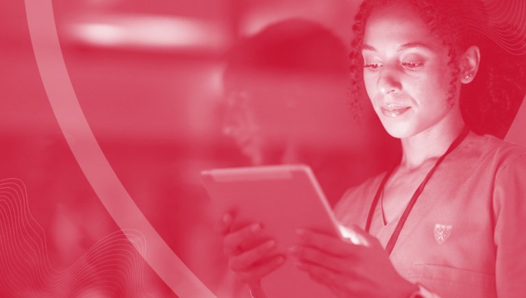 A red tint covering a person looking at a screen.