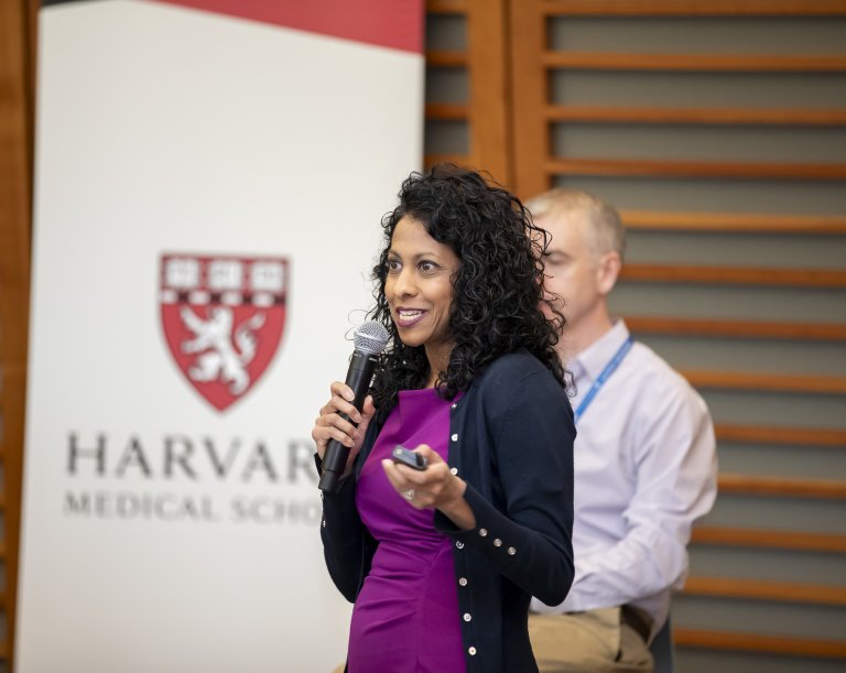 Faculty member speaks during a GCSRT in person session.