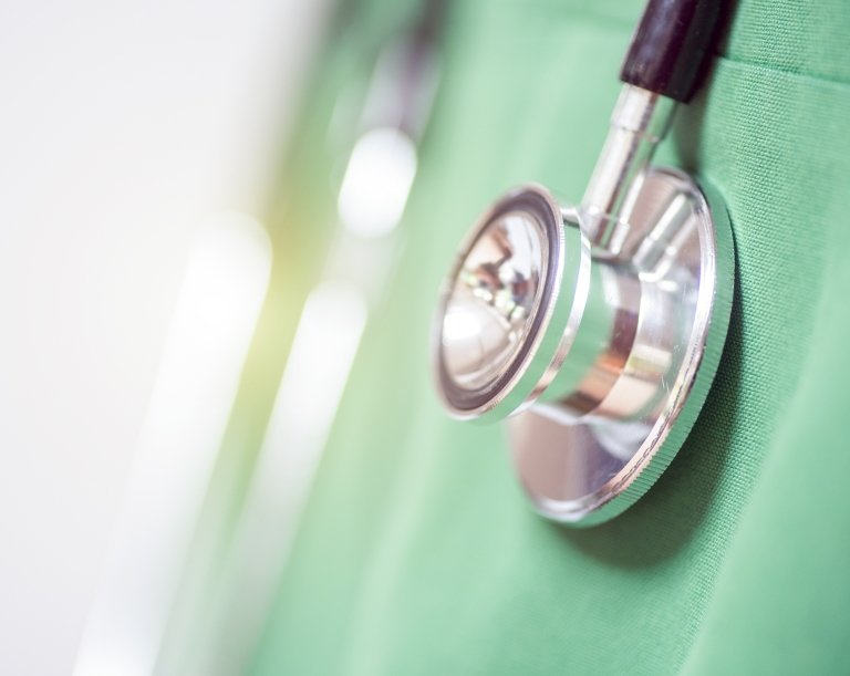 stethoscope on green scrubs
