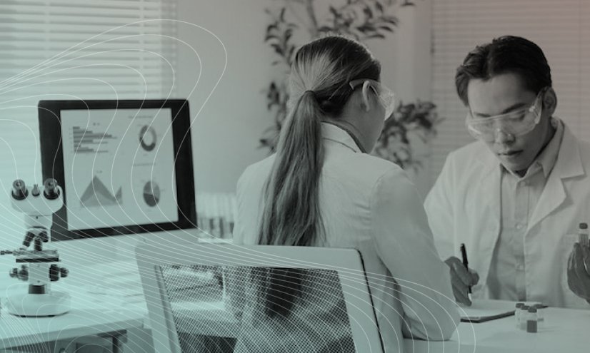 Two health care providers looking at data.