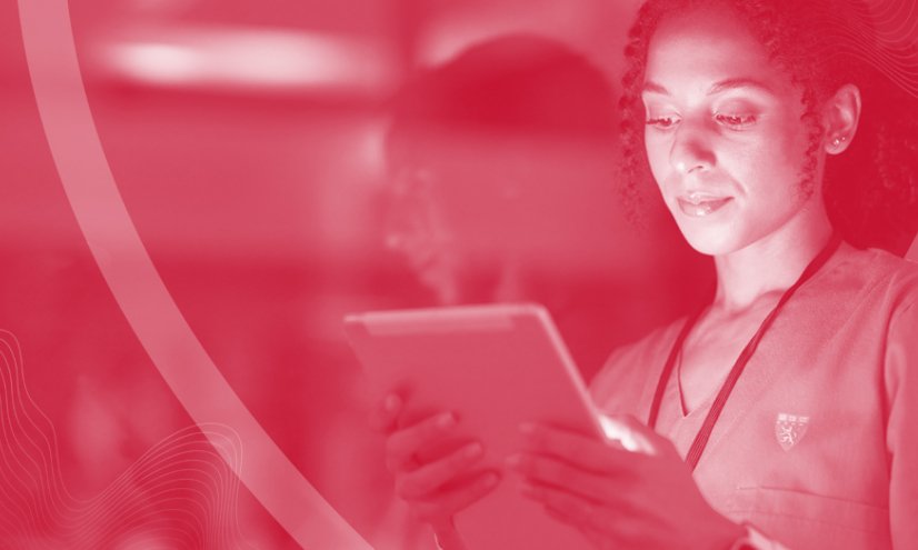 A red tint covering a person looking at a screen.