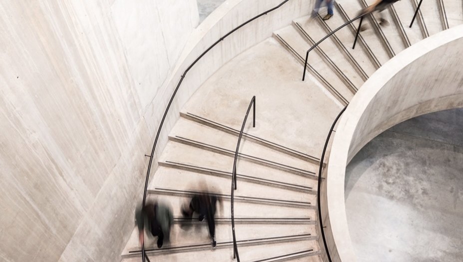 People walk down a staircase.