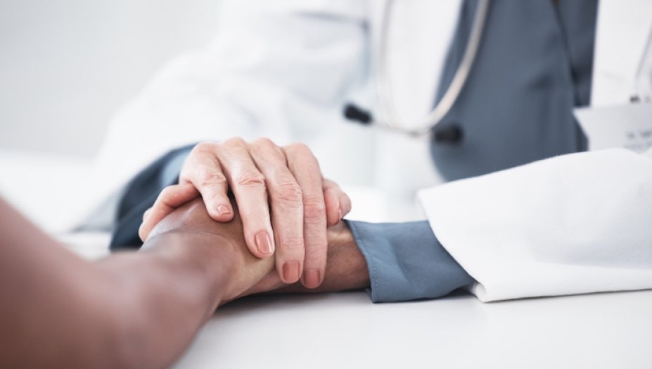 Physician comforting patient.