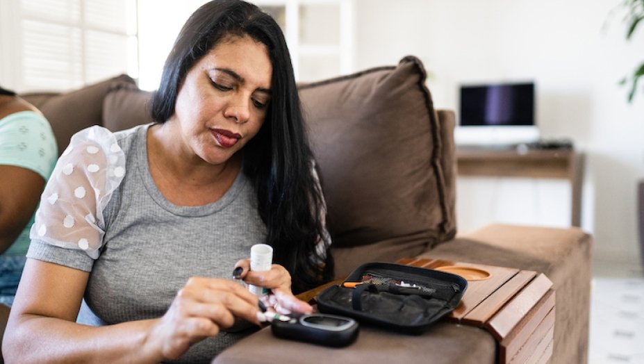 A woman takes her medication.