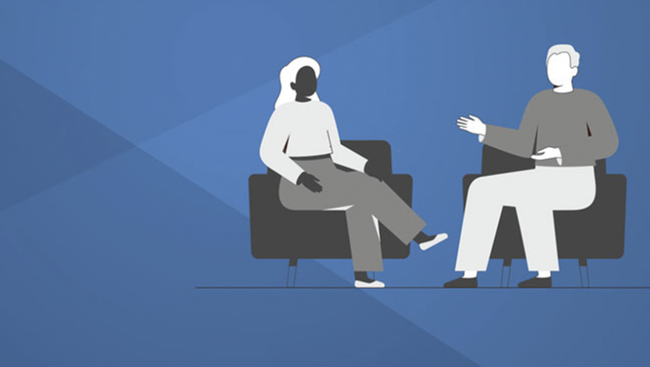 Two people sitting in chairs engaged in a conversation.
