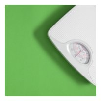 white analog scale with green background