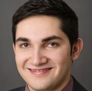 Carlos G. Torres Headshot.