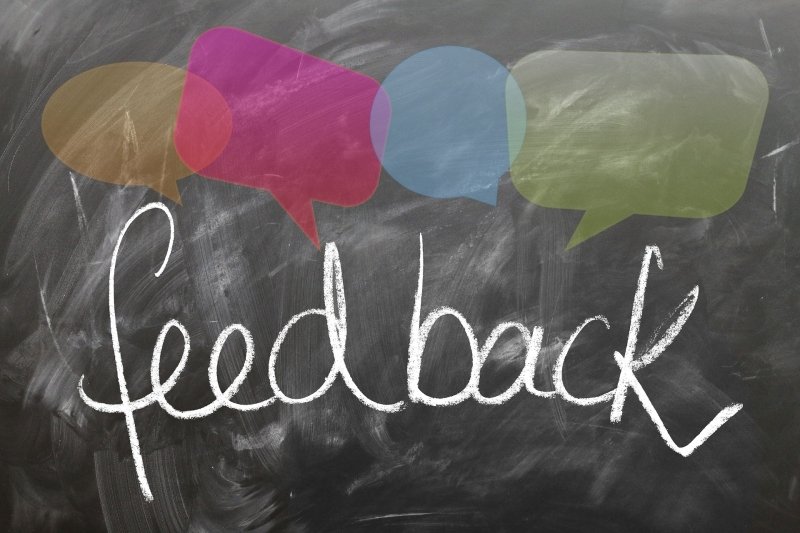 The word feedback written on a chalkboard.