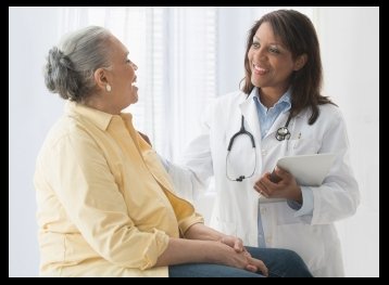 doctor talking to patient in office