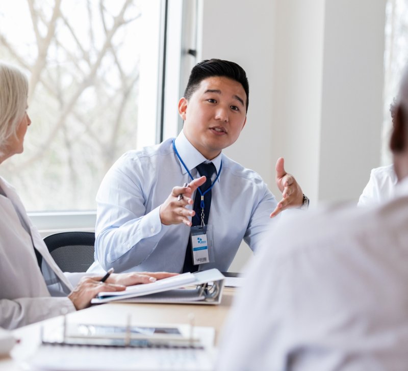 Business professional gestures in a meeting. 