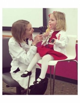 A doctor checks on a patient.